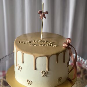 Golden Bow Drip Cake